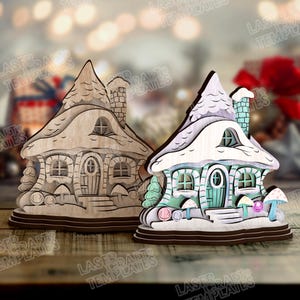 May include: Two wooden fairy house ornaments. One is unfinished, the other is painted with pastel colors, including blue, green, and pink. The houses have snow-covered roofs, chimneys, and mushroom accents. The text "LASER TEMPLATES" is visible.
