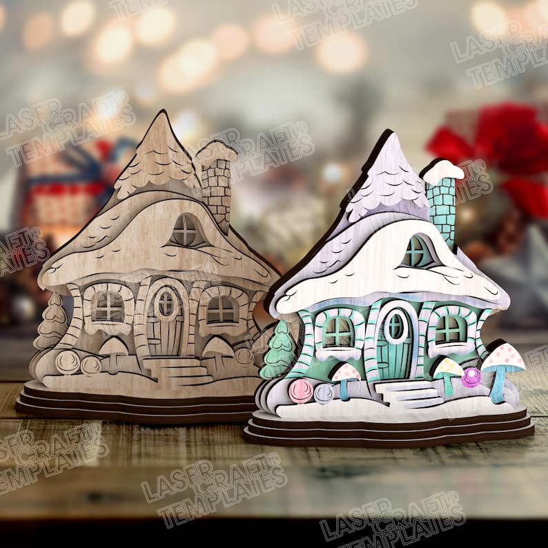 May include: Two wooden fairy house ornaments. One is unfinished, the other is painted with pastel colors, including blue, green, and pink. The houses have snow-covered roofs, chimneys, and mushroom accents. The text "LASER TEMPLATES" is visible.