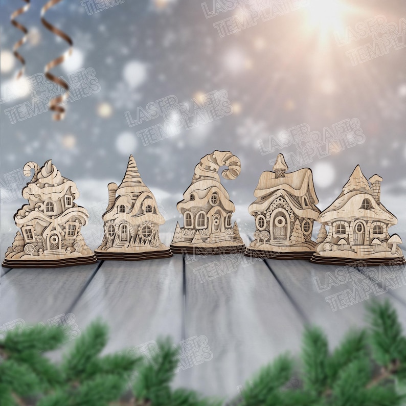 May include: Five wooden laser-cut decorative houses with intricate details. Each house has a unique design, including windows, doors, and chimneys. The houses are displayed on a wooden surface with a snowy background and evergreen branches.