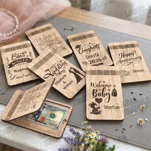 May include: A white ceramic mug with a black handle and the text "But First, Coffee" in a black, bold font. The mug is on a white surface.