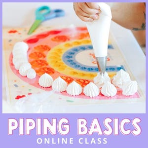 May include: A person is piping white frosting onto a colorful rainbow-themed mat. The mat has a rainbow design with orange, yellow, and blue sections. The image also shows a row of piped frosting and a pair of teal scissors. The text "PIPING BASICS ONLINE CLASS" is at the bottom.