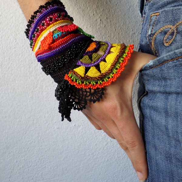 freeform crochet cuff - Gloriosa Superba: bracelet with colorful beaded crochet flowers and black crochet lace