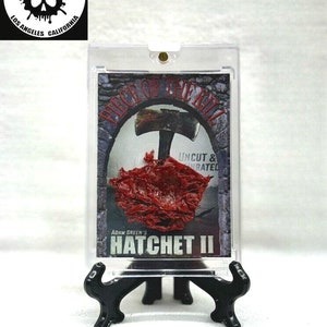 Tarjeta coleccionable de Adam Green's Hatchet II Piece of the Kill con accesorio de efectos especiales usado en pantalla que presenta a Chad