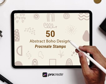 May include: A digital tablet displays a beige screen with abstract boho designs and the text "50 Abstract Boho Design Procreate Stamps." A hand holds a stylus, and the Procreate logo is visible. The tablet is on a white surface.