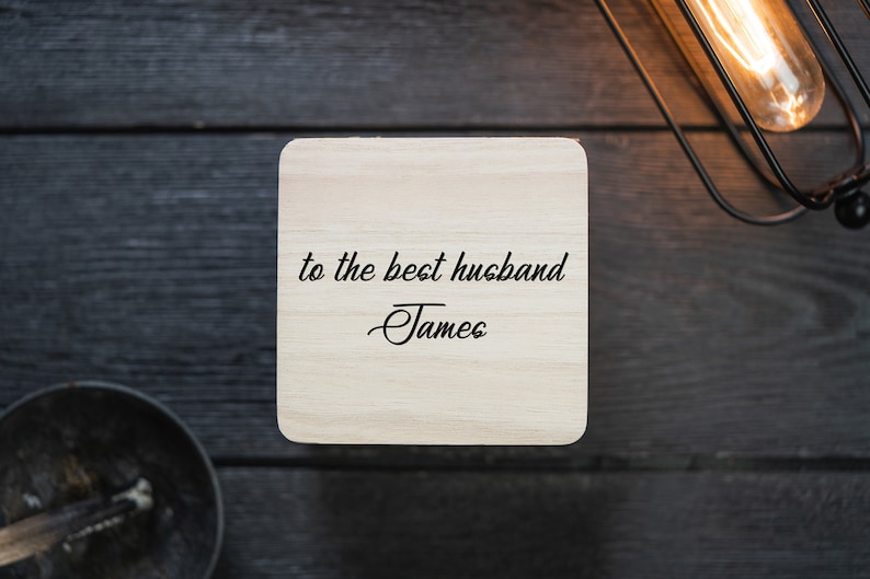 May include: A wooden coaster with the text "to the best husband -James" engraved on it.