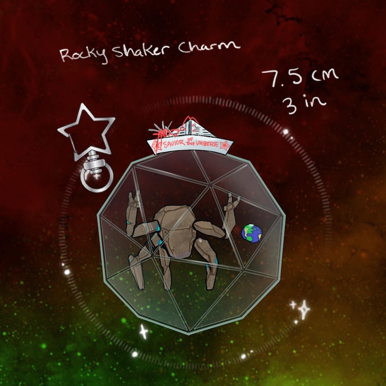 May include: A Rocky Shaker Charm measuring 7.5 cm or 3 inches, featuring a multi-faceted geometric container holding a brown rock-like figure and a small globe. A star-shaped attachment is included, with text reading Savior of the Universe.