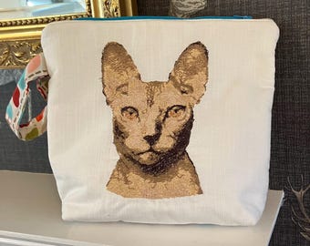 Grande pochette zippée avec motif chat nu.