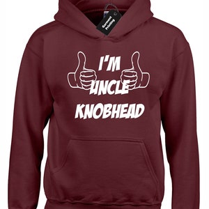 May include: Burgundy hooded sweatshirt with white text that reads "I'm Uncle Knobhead" with two thumbs up on either side of the text.