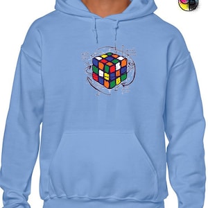 May include: A light blue hooded sweatshirt featuring a colourful Rubik's Cube graphic and mathematical equations printed on the front.