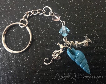 Llavero "Sweet Heart Siren Sea Dreams" con sirena, caballito de mar y concha.
