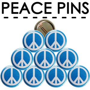 May include: A set of nine blue peace sign buttons with white peace symbols. The buttons are arranged in a pyramid shape.