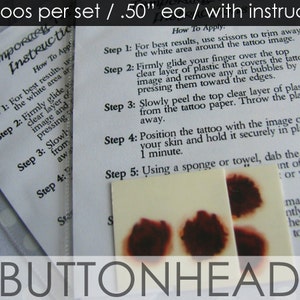May include: A set of four temporary tattoos, each measuring 0.50 inches, accompanied by a printed instruction sheet. The tattoos feature dark red, circular, blotchy designs on a white square backing. The text reads 4 tattoos per set / .50" ea / with instructions and BUTTONHEAD.