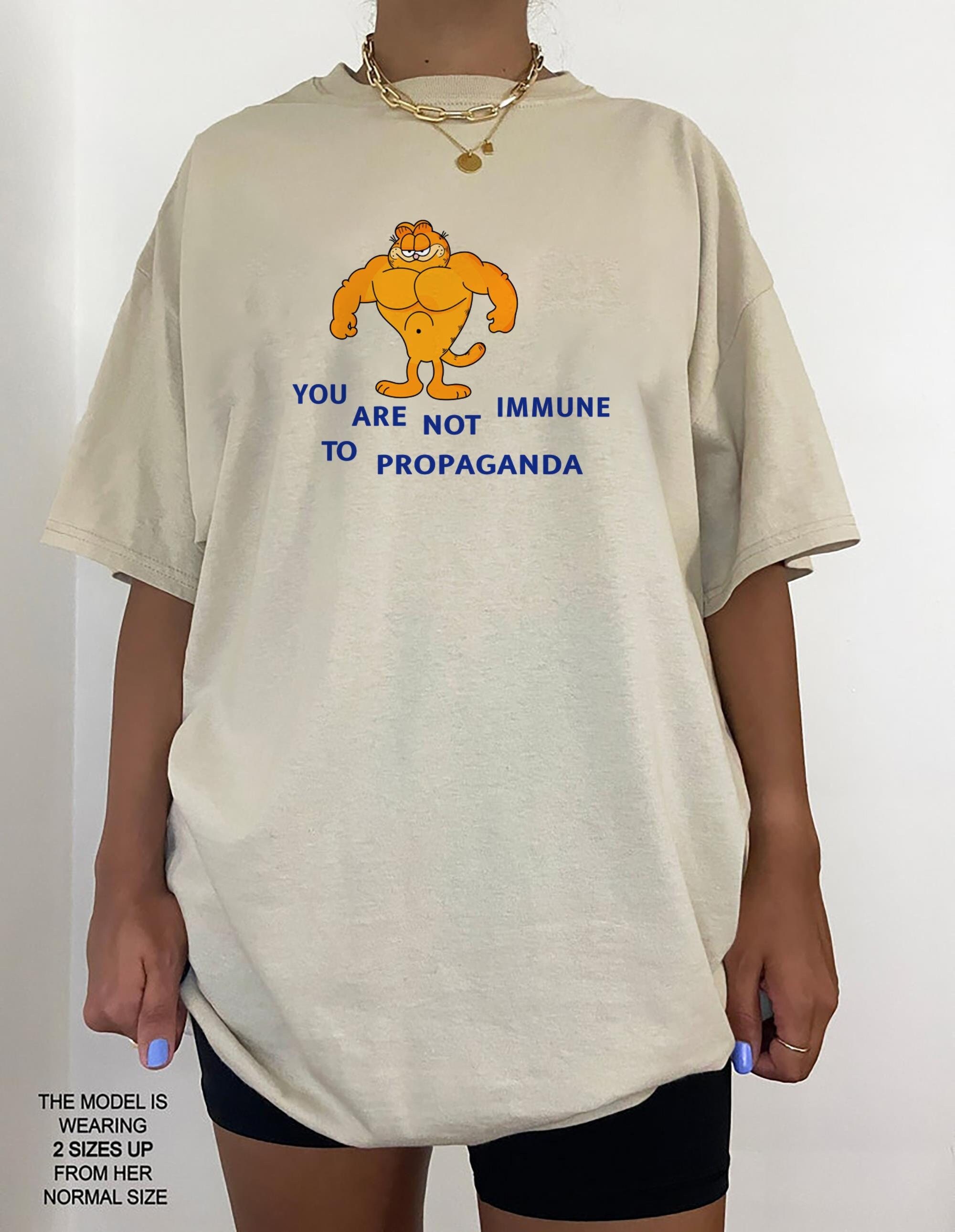 You are not immune to propaganda - garfield -the cat shirt sold by