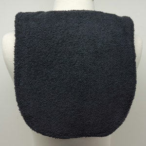 May include: A black, soft, and absorbent terry cloth bib with a rounded neckline.