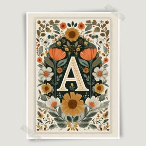 May include: A rectangular art print featuring a large, cream-coloured capital letter A centred within a dark green background. The letter is surrounded by a symmetrical arrangement of orange, yellow, and white flowers, green leaves, and vines.