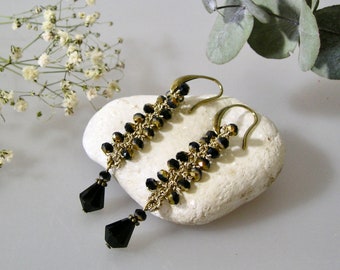 Boucles d'oreilles pendantes au crochet et perles en verre noir et doré