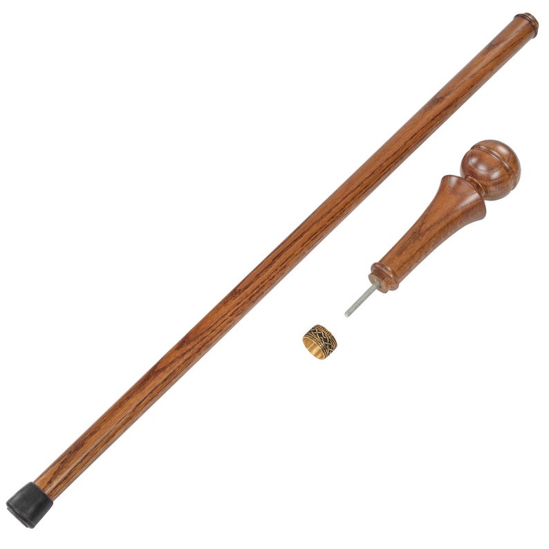 May include: A wooden walking stick with a brown finish. The stick has a black rubber tip on one end and a round wooden knob on the other end. A metal ring with a decorative pattern is included.