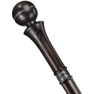 May include: A dark wood walking stick with a silver band and a round, dark wood knob at the top.