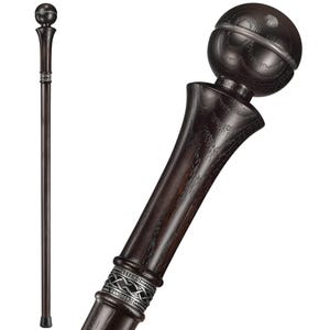 May include: A dark brown wooden walking stick with a silver band and a round, dark brown knob at the top.