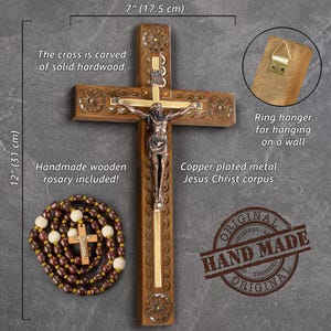 May include: A handcrafted wooden cross, 12 inches (31 cm) tall and 7 inches (17.5 cm) wide, with a copper-plated metal Jesus Christ corpus. Includes a handmade wooden rosary. The cross is carved from solid hardwood and has a ring hanger for wall display.