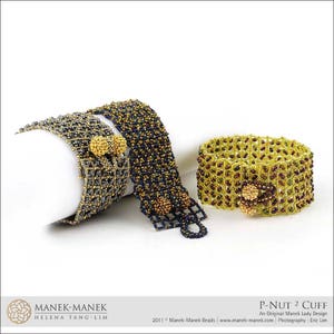 May include: Three beaded bracelets in gold, silver, and green with a geometric pattern. The bracelets are made with small beads and have a clasp closure. The bracelets are on a white surface. "P-NUT 2 CUFF" is written in the bottom right corner of the image. "An Original Manek Lady Design" is written below the title. "2011 Manek-Manek Beads | www.manek-manek.com Photography: Eric Lim" is written below the design description.