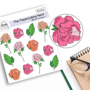 May include: A sheet of stickers featuring pink and orange peonies with green leaves. The stickers are designed by The Papercutting Nerd and are titled "Peonies".