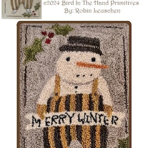May include: A punch needle pattern featuring a snowman wearing a black hat and striped overalls. The snowman is holding a banner that reads "Merry Winter". The pattern is surrounded by holly leaves and berries. The finished piece measures 10.8 cm by 15.2 cm.