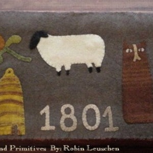 May include: A brown felt wall hanging featuring a white sheep, a brown cat, a white chicken, a beehive, and a red flower. The year 1801 is stitched in white on the brown felt.