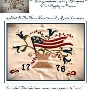 May include: Wool applique pattern for a patriotic Independence Day bouquet featuring a red, white, and blue flag, blue flowers, and red berries in a brown pot. The finished stitched area measures approximately 14 inches by 20 inches.