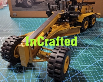 Caterpillar Cat 24 M väghyvel 1/50 skalmodell från DieCast Masters DM85264 ny låda
