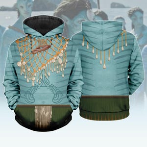 May include: A light blue hoodie with a design inspired by the movie Avatar. The front features a net-like pattern with pearl-like accents and a brown pendant. The back has a striped pattern and pearl-like accents. The bottom hem is green.