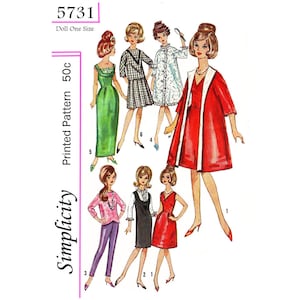 May include: Simplicity sewing pattern number 5731 for a doll. The pattern includes five different outfits: a green dress, a black and white checked dress, a white dress with lace, a red dress with a white collar, and a pink sweater with purple trousers.