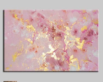 May include: Abstract painting with pink and gold hues. The painting features a marbled effect with swirls of pink, white, and gold paint. The painting is framed and hanging on a wall.