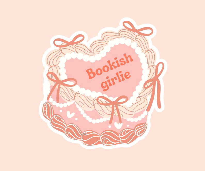 May include: A pink heart-shaped sticker with white swirls and pink bows. The sticker says "Bookish girlie" in orange text.