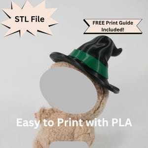 May include: A soft toy wearing a black witch's hat with a green band. The image includes text that reads "STL File" and "FREE Print Guide Included!" and "Easy to Print with PLA".