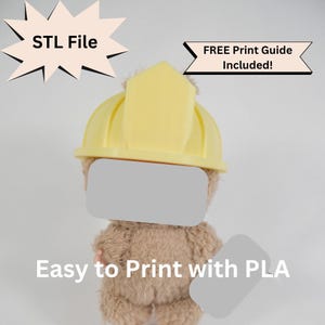 May include: A soft toy teddy bear wearing a yellow construction helmet. The image includes the text "STL File", "FREE Print Guide Included!", and "Easy to Print with PLA". The bear's face is covered with a grey rectangle.