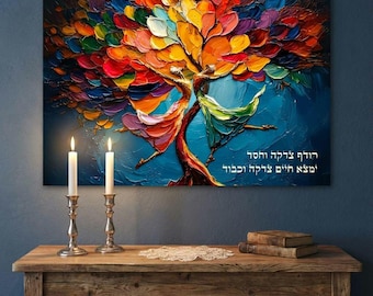 May include: A vibrant, abstract painting of a tree with colorful leaves in shades of red, orange, yellow, and purple. The tree's trunk and branches are a deep brown, set against a blue background. Two lit candles in silver holders sit on a wooden table.
