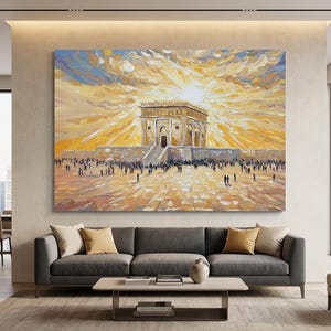 May include: Large oil painting depicting a historical building with a bright yellow and orange sky. The building has a central entrance and is surrounded by a crowd of people. The artwork is displayed above a gray sofa.