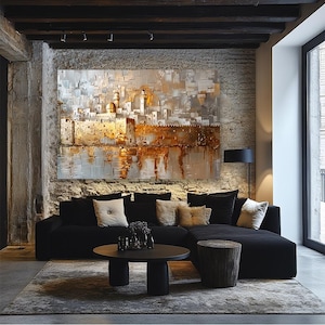 May include: A large rectangular wall art piece featuring an abstract cityscape with a prominent golden dome and textured metallic gold and white paint strokes. The artwork depicts a dense cluster of buildings and architectural structures.