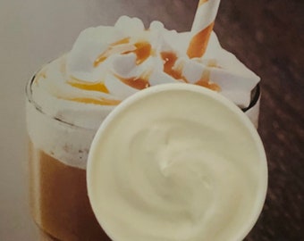 May include: A tall glass filled with a coffee drink topped with whipped cream and caramel sauce. A striped straw sticks out of the drink. A white lid is on top of the whipped cream.