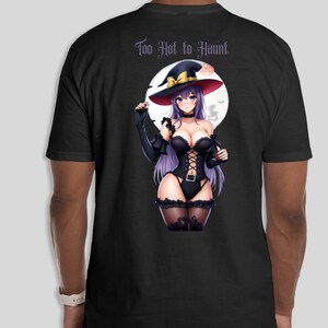May include: Black t-shirt featuring a witch illustration with purple hair, a black corset, and a witch hat. The text "Too Hot to Haunt" is printed above the illustration. The design is set against a full moon background.