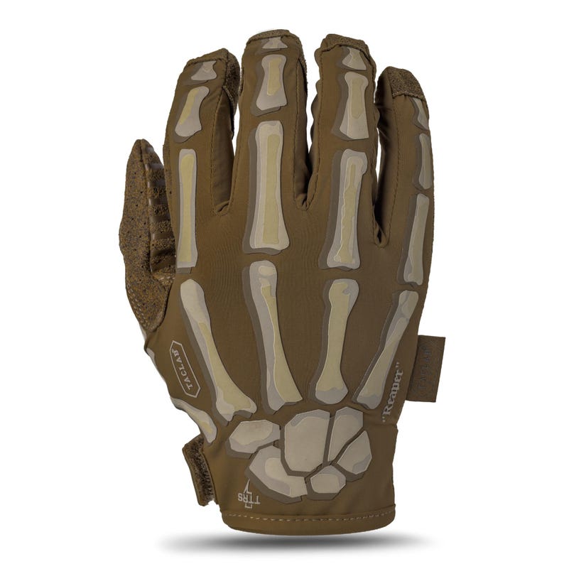 May include: A tan tactical glove featuring a printed skeleton hand design in lighter beige tones. The glove includes a textured thumb panel, a small rectangular tag labeled Reaper, a hexagonal patch marked TACLAB, and a small TTRS logo near the wrist.
