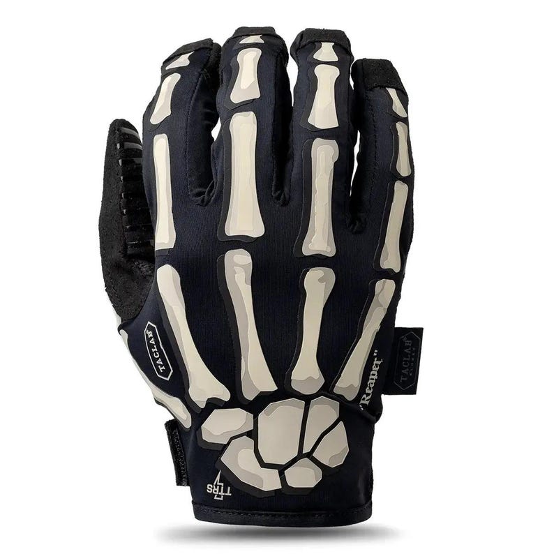 May include: A black glove featuring a white skeletal hand print on the back. The design includes finger and wrist bones. The glove displays the text TACLAB on a small patch, the word Reaper on a side tag, and the letters TTRS near the wrist area.