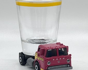 the Original Hot Shot shot glass, '65 Ford C900 Truck, Matchbox car