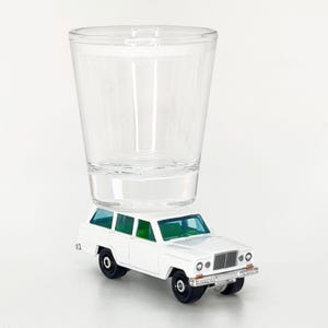 The ORIGINAL Hot Shot, Shot Glass, 1964 Jeep Wagoneer, White MB Die Cast vehicle