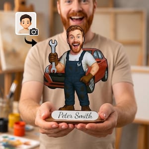 May include: A custom acrylic standee featuring a cartoon mechanic with a red beard, wearing blue overalls and brown gloves, holding a silver wrench. Behind the character is a red car. The base is wood with a white plaque reading Peter Smith.