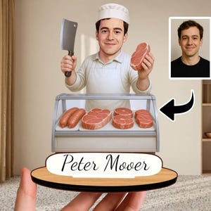 May include: A personalized butcher figurine featuring a smiling butcher holding a cleaver and a cut of meat. The figurine includes a display case with sausages and steaks, and the name "Peter Mover" on the base.