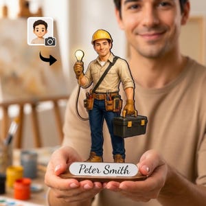 May include: A custom figurine of an electrician wearing a yellow hard hat, tan shirt, and blue jeans. The figure holds a glowing light bulb and a black toolbox, standing on a wooden base with the name Peter Smith printed in black script.