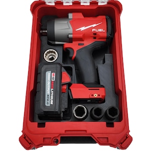 May include: A red and black power tool set in a red case. The set includes a red and gray impact wrench with the word "FUEL" on it, a battery, and several sockets. The case is open, revealing the tools inside.