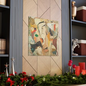 May include: Abstract art painting with a mix of colors, including yellow, orange, red, green, and blue. The painting is framed and hanging on a wall.